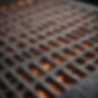 A close-up view of stove top grates showcasing various materials.