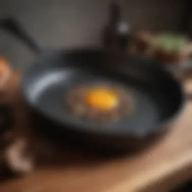 A close-up of the interior of a cast iron pan after being used, showing the seasoning and wear