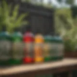 Variety of herbicide bottles lined up on a garden table