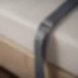 A close-up view of a mattress suspender showcasing its unique design features