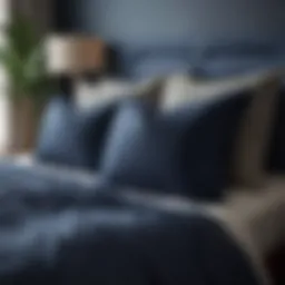 Elegant navy blue coastal bedding set with decorative pillows