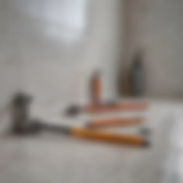 Close-up of caulking tools laid out on a bathroom surface