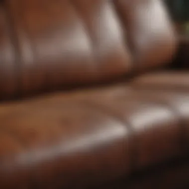 Close-up of leather sofa with frayed stitching